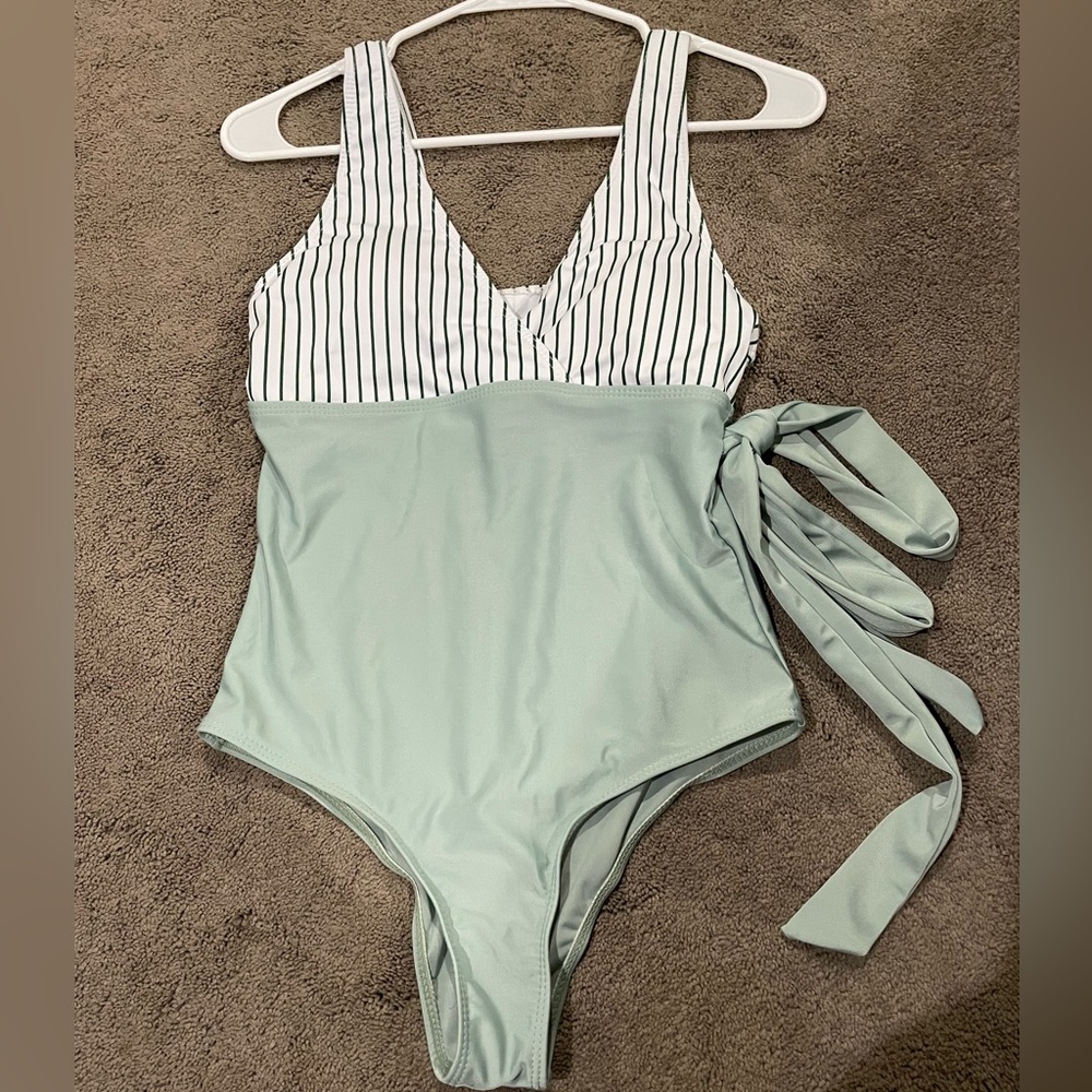 SHEIN medium green and white and black striped swimsuit.